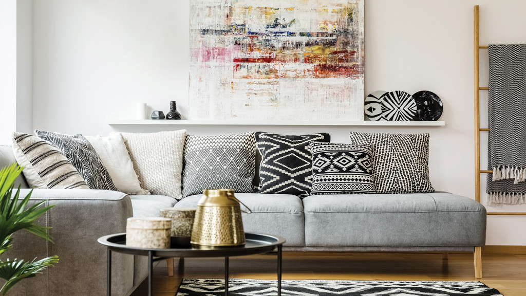 Bold comfort Mix-and-match pillows in bold patterns and textures create an inviting space.